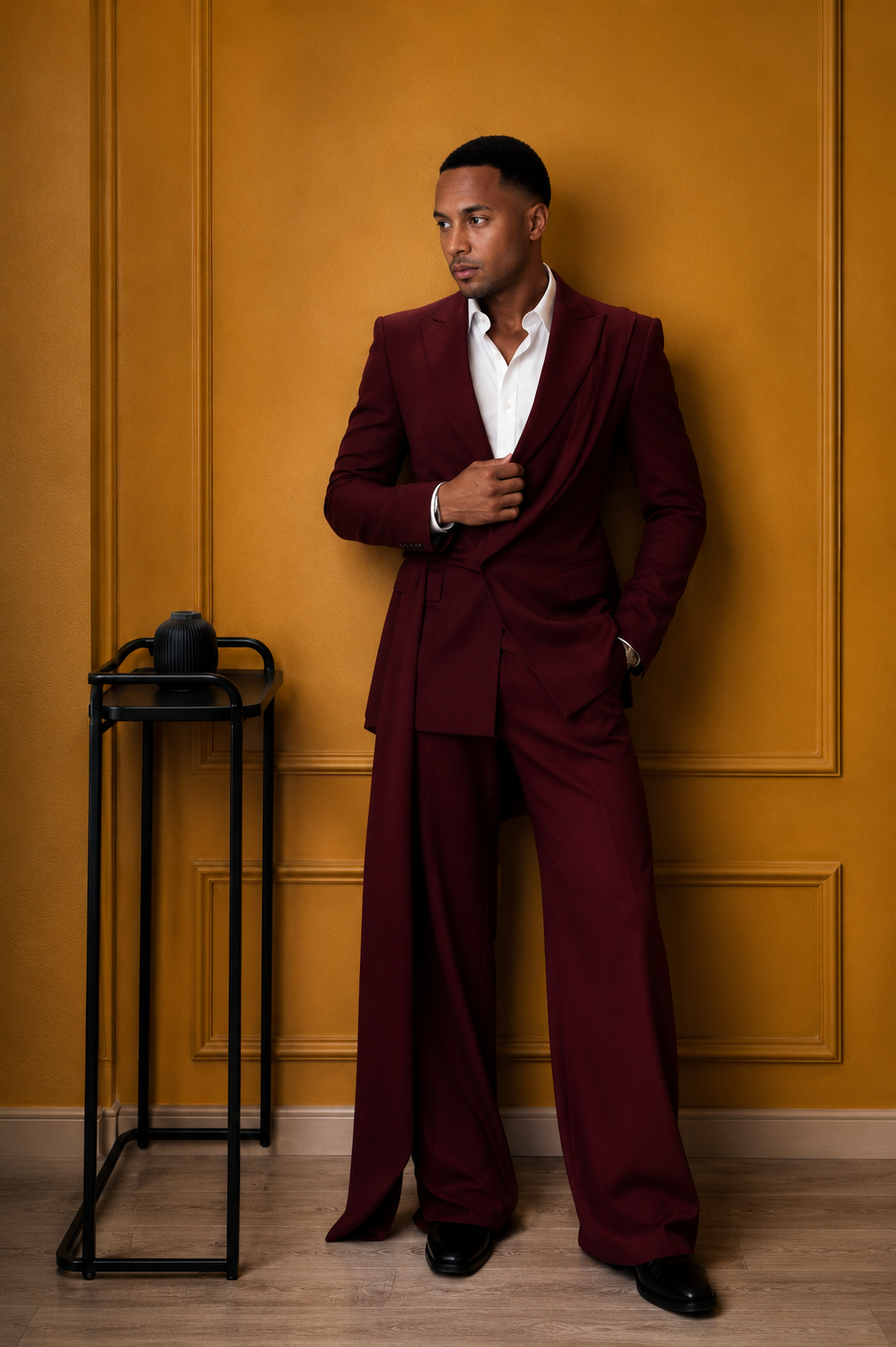 Man wearing a burgundy tailored double-breasted suit.